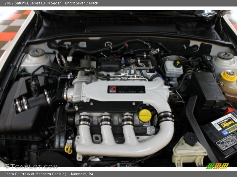 Bright Silver / Black 2002 Saturn L Series L300 Sedan