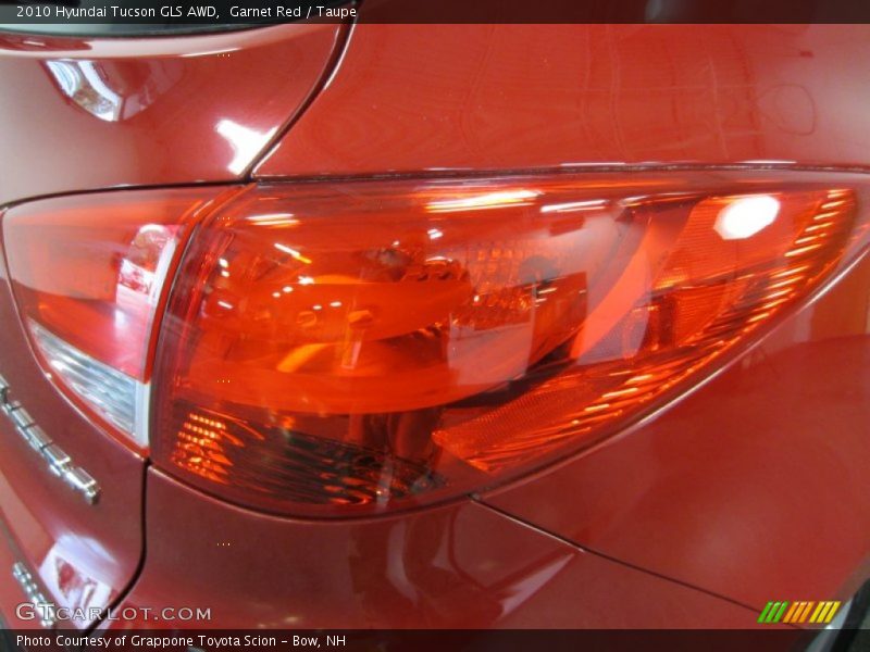 Garnet Red / Taupe 2010 Hyundai Tucson GLS AWD