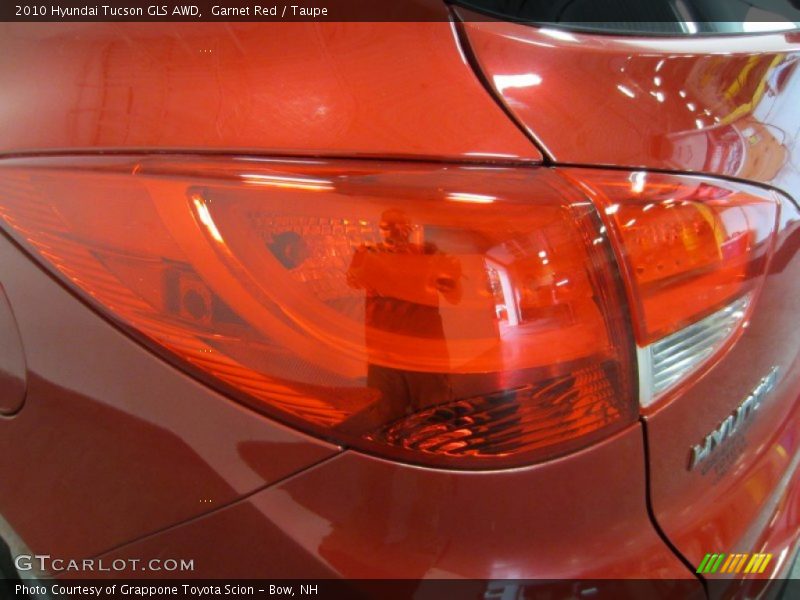 Garnet Red / Taupe 2010 Hyundai Tucson GLS AWD