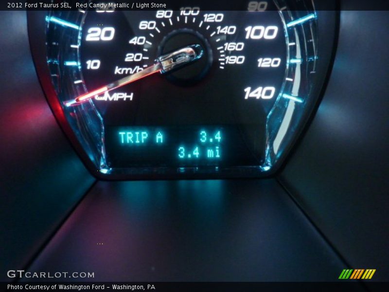 Red Candy Metallic / Light Stone 2012 Ford Taurus SEL