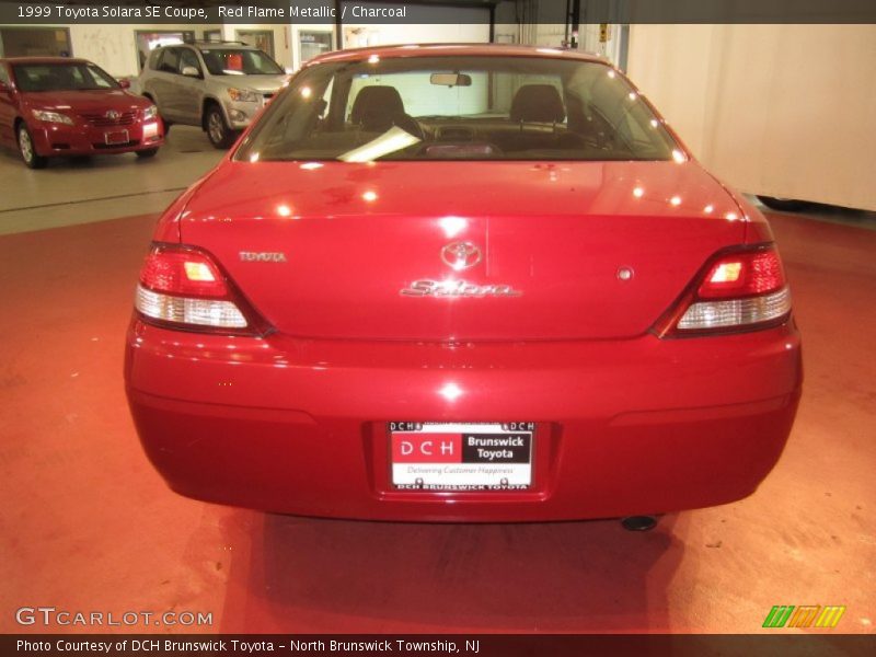 Red Flame Metallic / Charcoal 1999 Toyota Solara SE Coupe