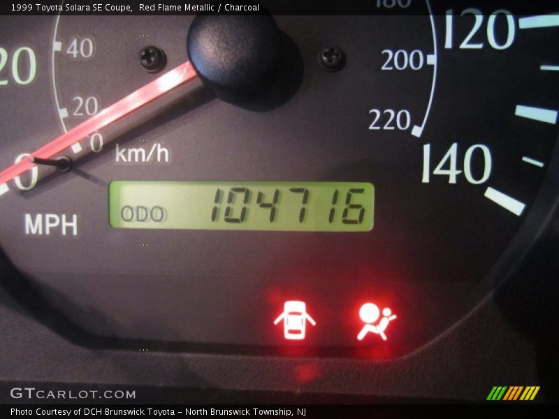 Red Flame Metallic / Charcoal 1999 Toyota Solara SE Coupe