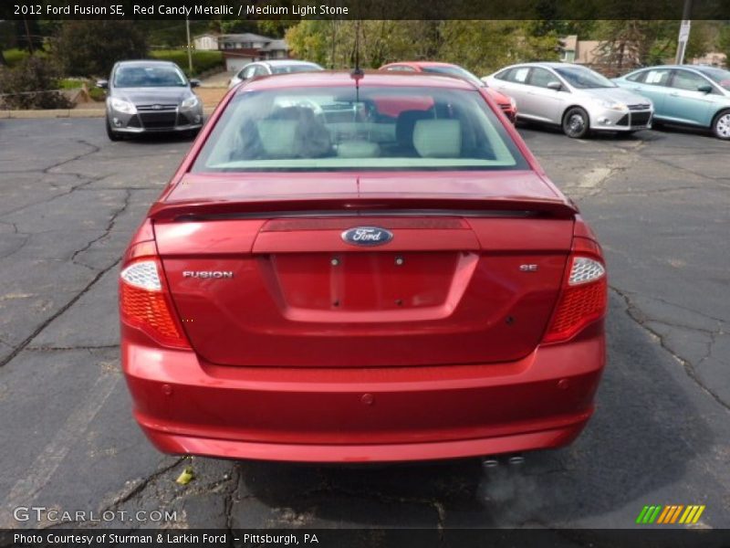 Red Candy Metallic / Medium Light Stone 2012 Ford Fusion SE