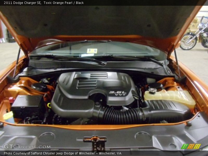 Toxic Orange Pearl / Black 2011 Dodge Charger SE