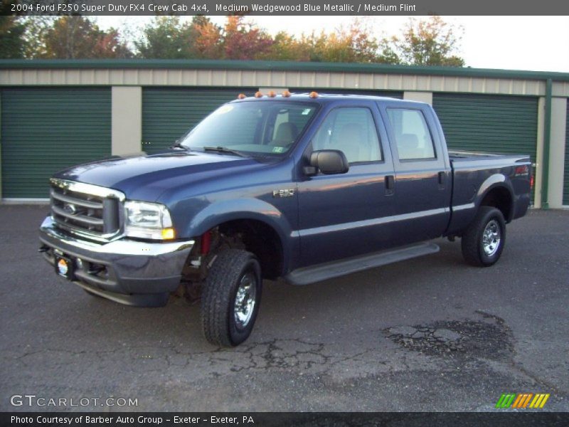 Front 3/4 View of 2004 F250 Super Duty FX4 Crew Cab 4x4