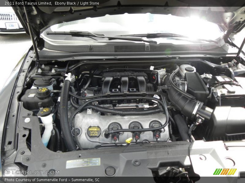 Ebony Black / Light Stone 2011 Ford Taurus Limited