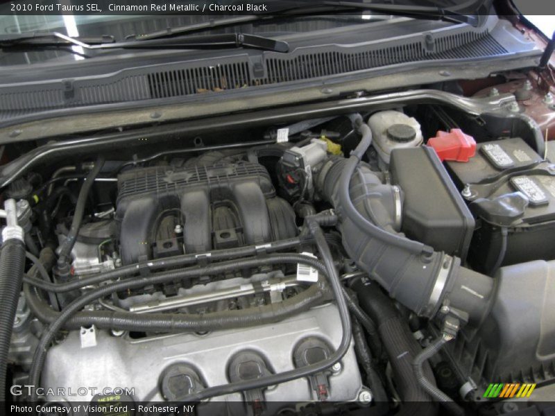 Cinnamon Red Metallic / Charcoal Black 2010 Ford Taurus SEL