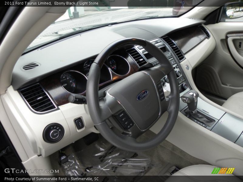 Ebony Black / Light Stone 2011 Ford Taurus Limited