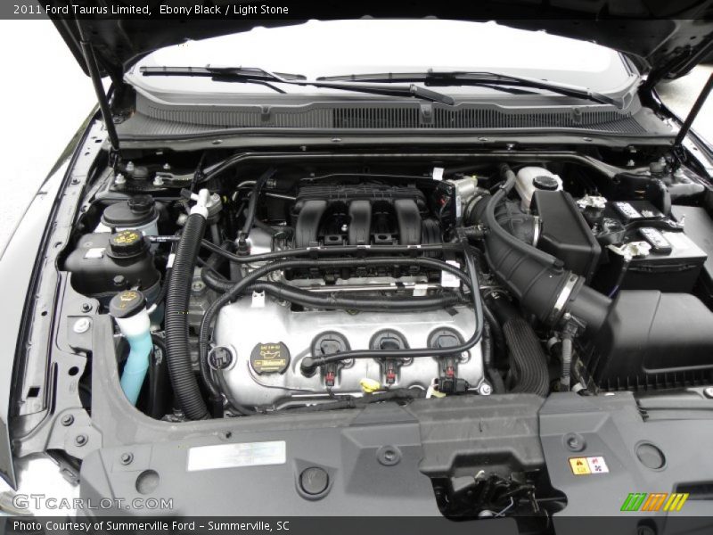 Ebony Black / Light Stone 2011 Ford Taurus Limited