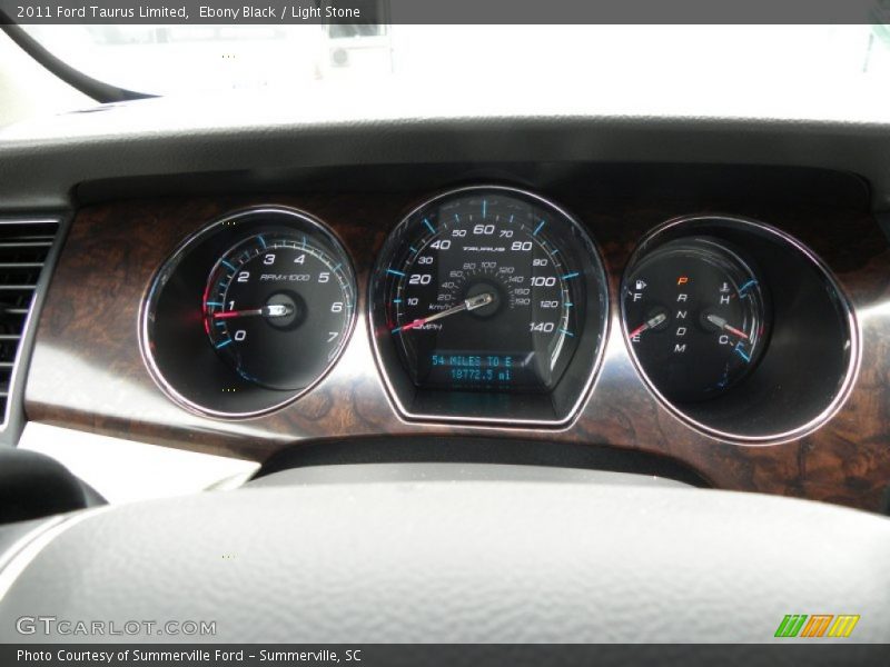 Ebony Black / Light Stone 2011 Ford Taurus Limited