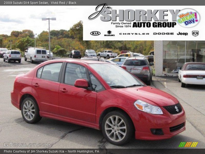 Vivid Red / Black 2009 Suzuki SX4 Sport Sedan