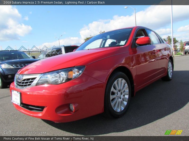 Lightning Red / Carbon Black 2009 Subaru Impreza 2.5i Premium Sedan