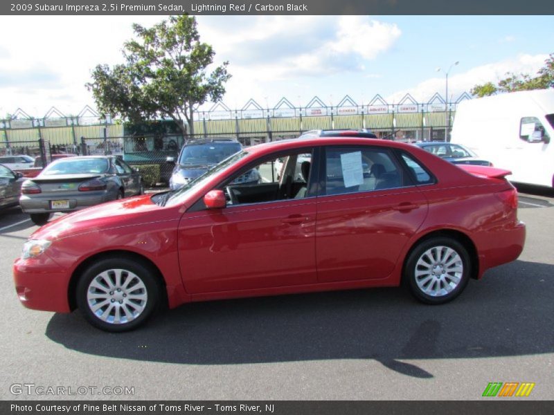 Lightning Red / Carbon Black 2009 Subaru Impreza 2.5i Premium Sedan