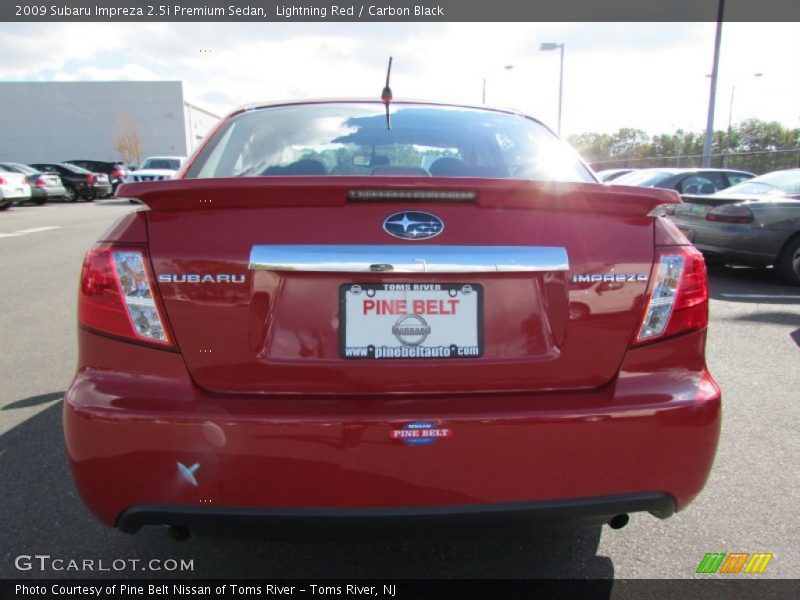 Lightning Red / Carbon Black 2009 Subaru Impreza 2.5i Premium Sedan