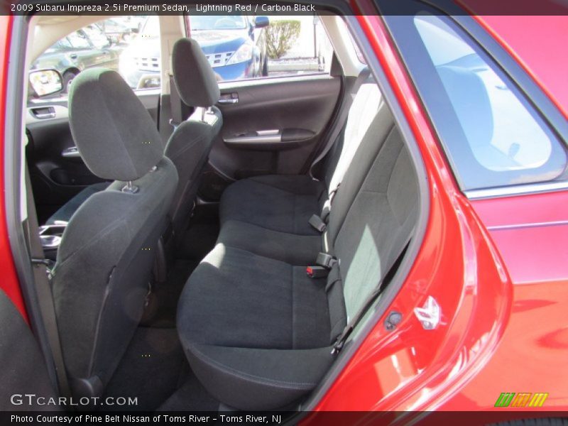 Lightning Red / Carbon Black 2009 Subaru Impreza 2.5i Premium Sedan