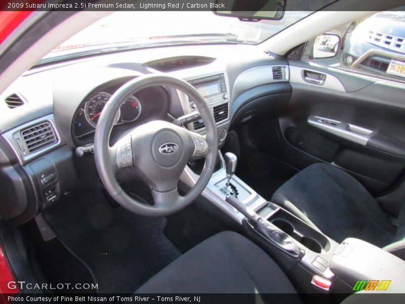 Lightning Red / Carbon Black 2009 Subaru Impreza 2.5i Premium Sedan