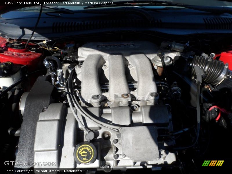 Toreador Red Metallic / Medium Graphite 1999 Ford Taurus SE
