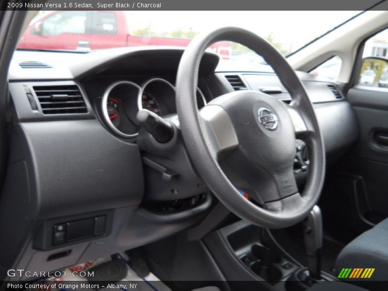Super Black / Charcoal 2009 Nissan Versa 1.6 Sedan