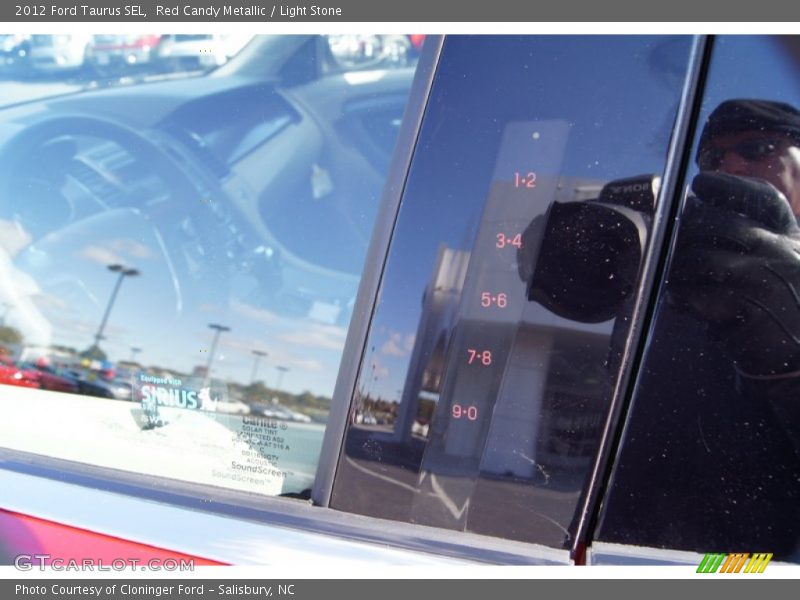 Red Candy Metallic / Light Stone 2012 Ford Taurus SEL