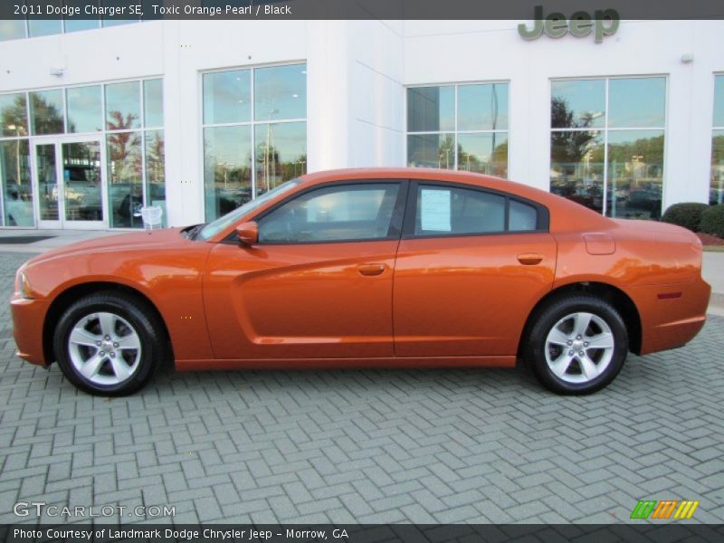 Toxic Orange Pearl / Black 2011 Dodge Charger SE