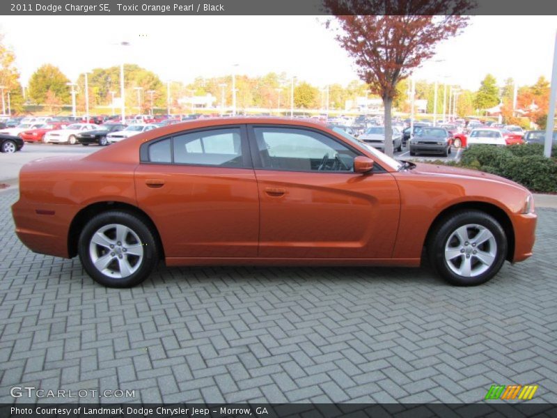 Toxic Orange Pearl / Black 2011 Dodge Charger SE