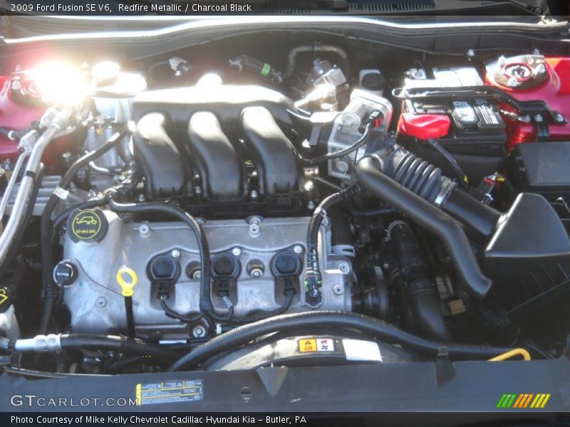 Redfire Metallic / Charcoal Black 2009 Ford Fusion SE V6