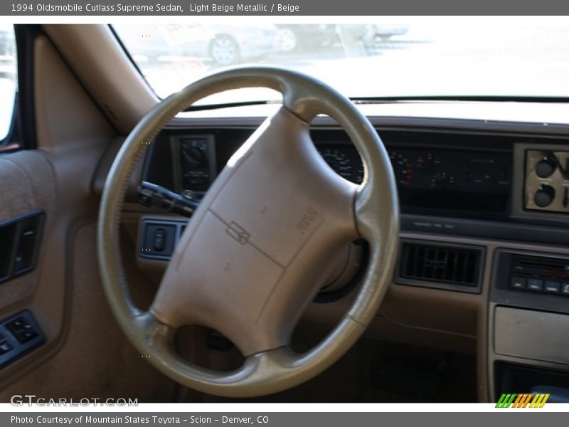 Light Beige Metallic / Beige 1994 Oldsmobile Cutlass Supreme Sedan