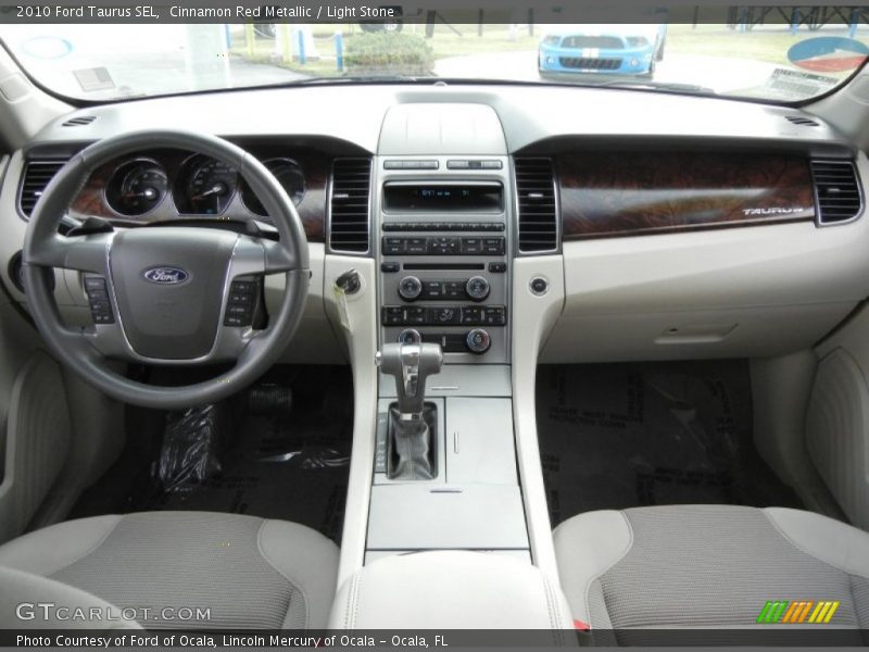 Cinnamon Red Metallic / Light Stone 2010 Ford Taurus SEL