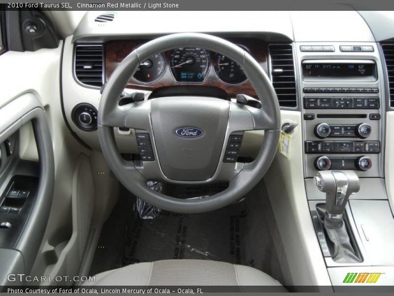 Cinnamon Red Metallic / Light Stone 2010 Ford Taurus SEL