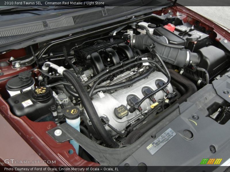Cinnamon Red Metallic / Light Stone 2010 Ford Taurus SEL