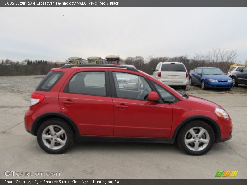 Vivid Red / Black 2009 Suzuki SX4 Crossover Technology AWD