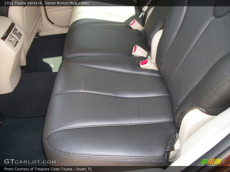 After-market Black seat covers on Ivory interior - 2011 Toyota Venza I4