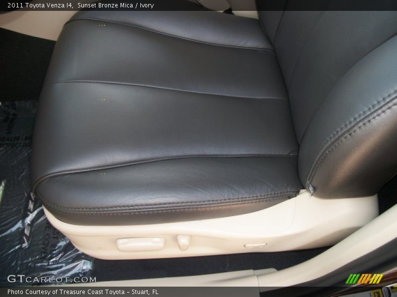 After-market Black seat covers on Ivory interior - 2011 Toyota Venza I4