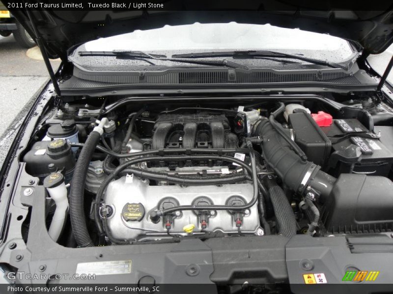 Tuxedo Black / Light Stone 2011 Ford Taurus Limited