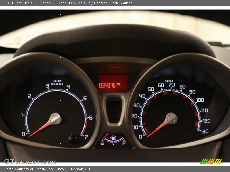 Tuxedo Black Metallic / Charcoal Black Leather 2011 Ford Fiesta SEL Sedan