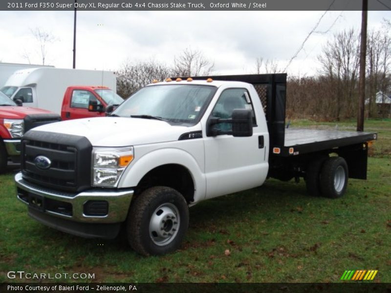Front 3/4 View of 2011 F350 Super Duty XL Regular Cab 4x4 Chassis Stake Truck