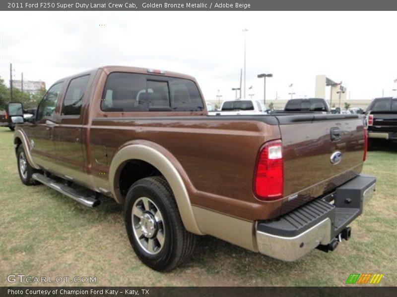 Golden Bronze Metallic / Adobe Beige 2011 Ford F250 Super Duty Lariat Crew Cab