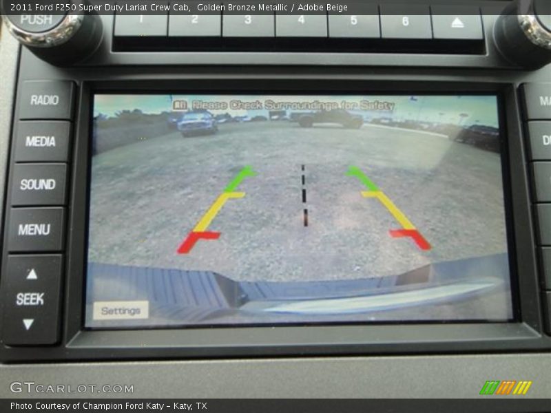 Golden Bronze Metallic / Adobe Beige 2011 Ford F250 Super Duty Lariat Crew Cab