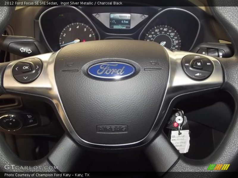 Ingot Silver Metallic / Charcoal Black 2012 Ford Focus SE SFE Sedan
