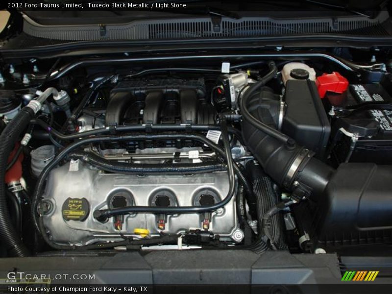 Tuxedo Black Metallic / Light Stone 2012 Ford Taurus Limited