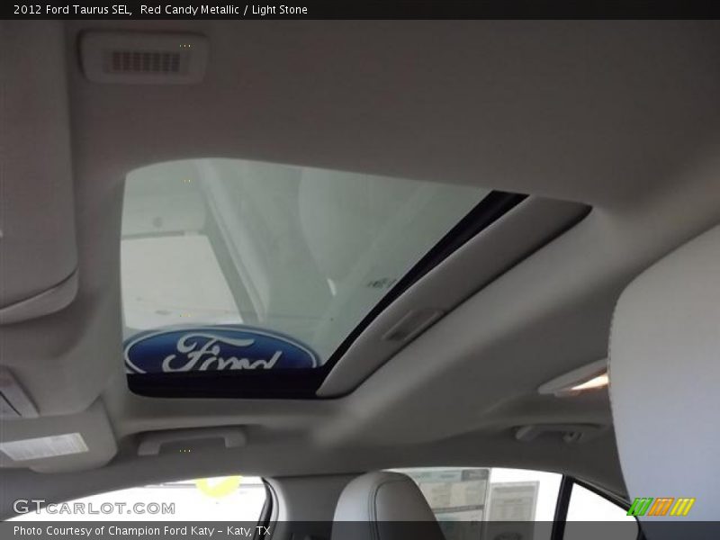 Red Candy Metallic / Light Stone 2012 Ford Taurus SEL