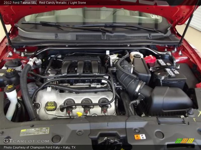 Red Candy Metallic / Light Stone 2012 Ford Taurus SEL