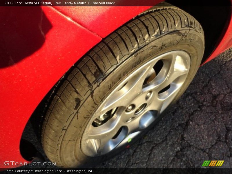 Red Candy Metallic / Charcoal Black 2012 Ford Fiesta SEL Sedan
