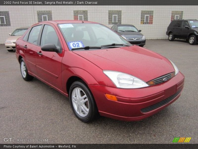 Sangria Red Metallic / Dark Charcoal 2002 Ford Focus SE Sedan