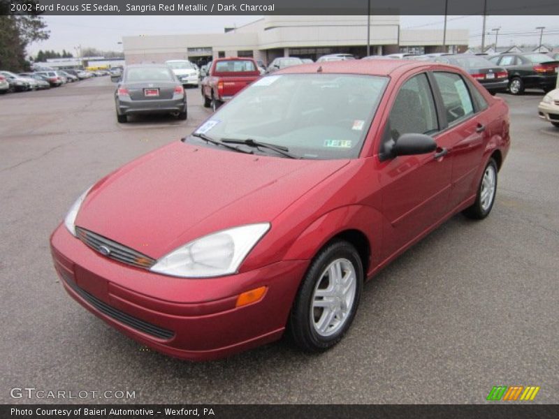 Sangria Red Metallic / Dark Charcoal 2002 Ford Focus SE Sedan