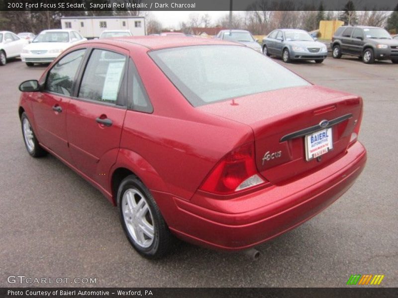 Sangria Red Metallic / Dark Charcoal 2002 Ford Focus SE Sedan