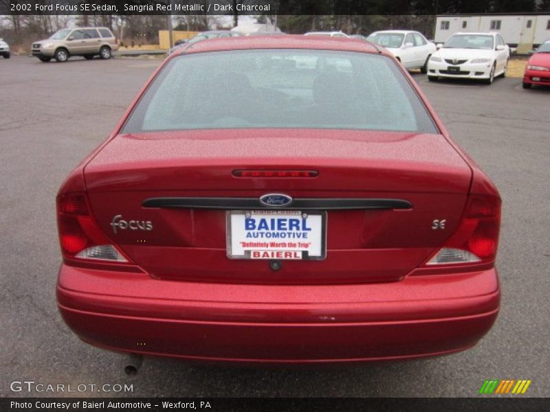 Sangria Red Metallic / Dark Charcoal 2002 Ford Focus SE Sedan
