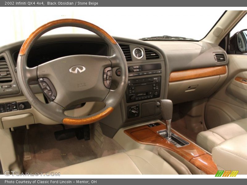 Black Obsidian / Stone Beige 2002 Infiniti QX4 4x4
