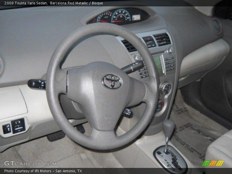 Barcelona Red Metallic / Bisque 2009 Toyota Yaris Sedan