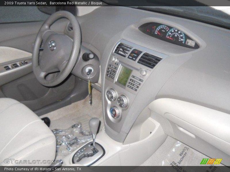 Barcelona Red Metallic / Bisque 2009 Toyota Yaris Sedan